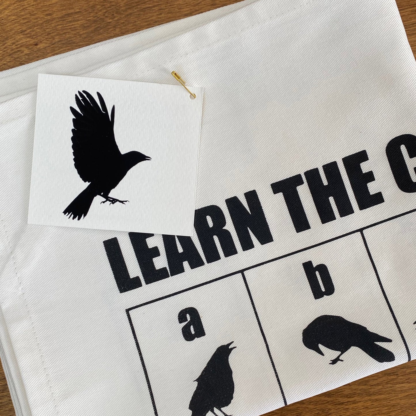 LEARNING THE CROWPHABET - Tea Towel