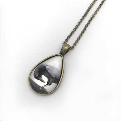 DOWNWARD CROW Teardrop-Shaped Glass Pendant